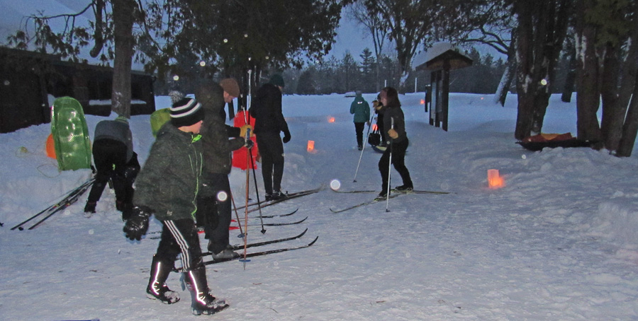 A candlelight ski and snowshoe hike is a highlight of Winterfest at Pattison State Park. - Photo credit: DNR