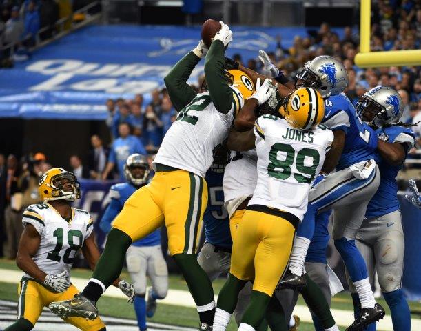Richard Rodgers reels in the 61-yard touchdown pass from Aaron Rodgers, a Hail Mary that became iconic on Dec. 3, 2015. It's one of several photos in 