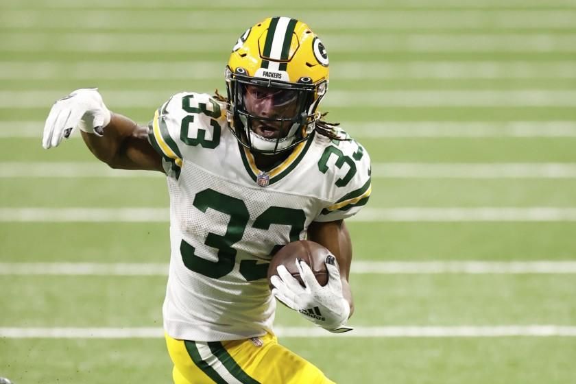 Green Bay Packers running back Aaron Jones (33) rushes in the second half against the Detroit Lions.