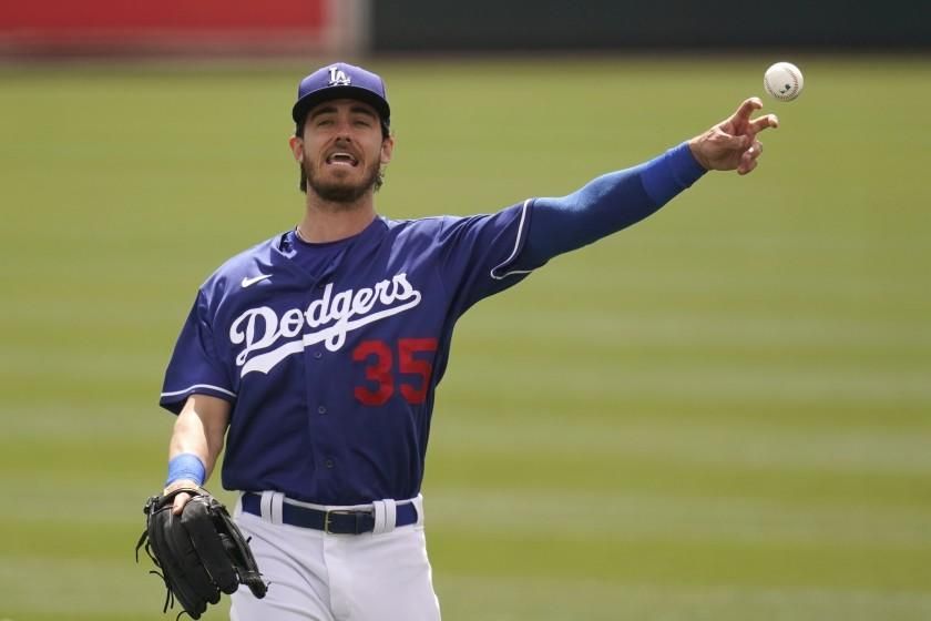 Los Angeles Dodgers&#39; Cody Bellinger warms up prior to the team&#39;s spring training baseball game against the Milwaukee Brewers on Tuesday, March 16, 2021, in Phoenix. (AP Photo/Ross D. Franklin)