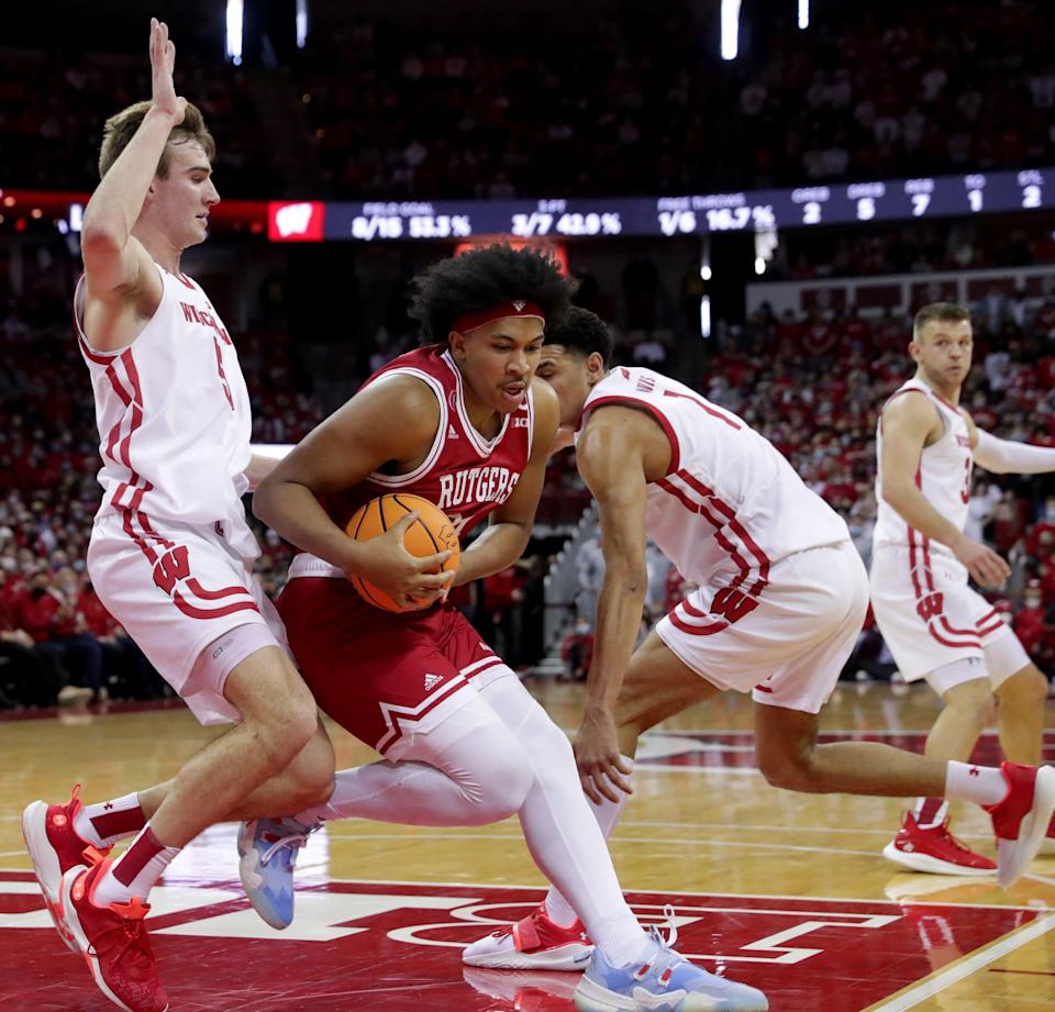 Rutgers forward Ron Harper Jr. drives between Wisconsin forward Tyler Wahl (5) and Johnny Davis on Saturday at the Kohl Center. Harper finished with a team-high 21 points.