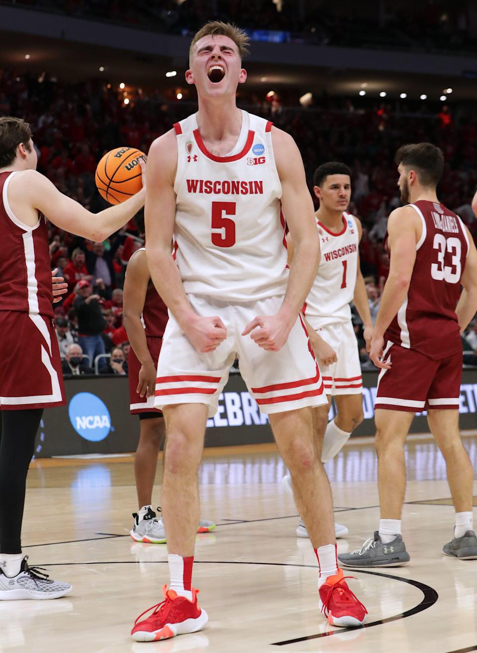 Wisconsin forward Tyler Wahl (5) reacts after being fouled after hitting a basket against Colgate during the second half in their first round game in the NCAA Tournament at Fiserv Forum on Friday.