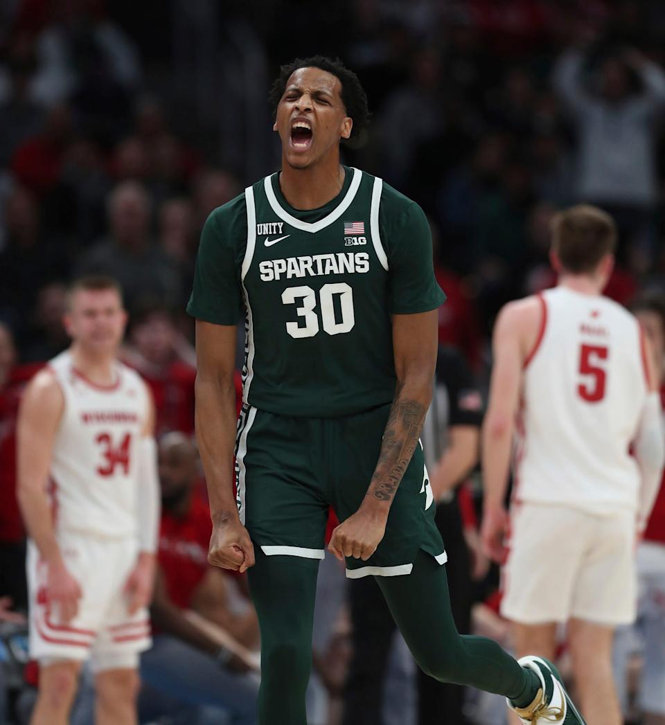 Michigan State Spartans forward Marcus Bingham Jr. (30) reacts after a basket against the Wisconsin Badgers during second half action of the Big Ten tournament Friday, Mar. 11, 2022 at Gainbridge Fieldhouse.