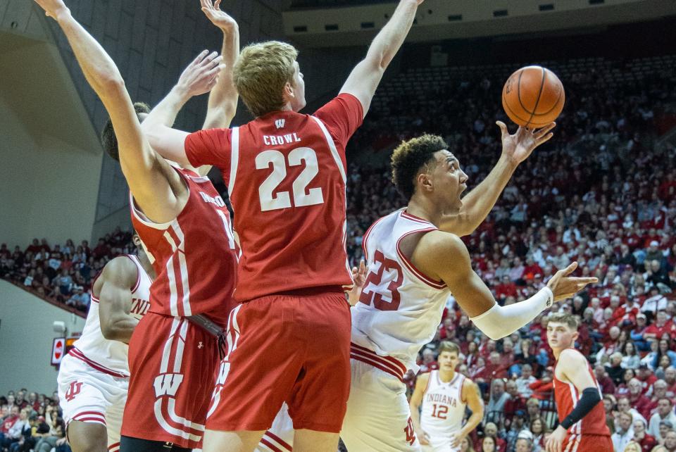 Indiana forward Trayce Jackson-Davis shoots while Wisconsin forward Steven Crowl defends Saturday afternoon.