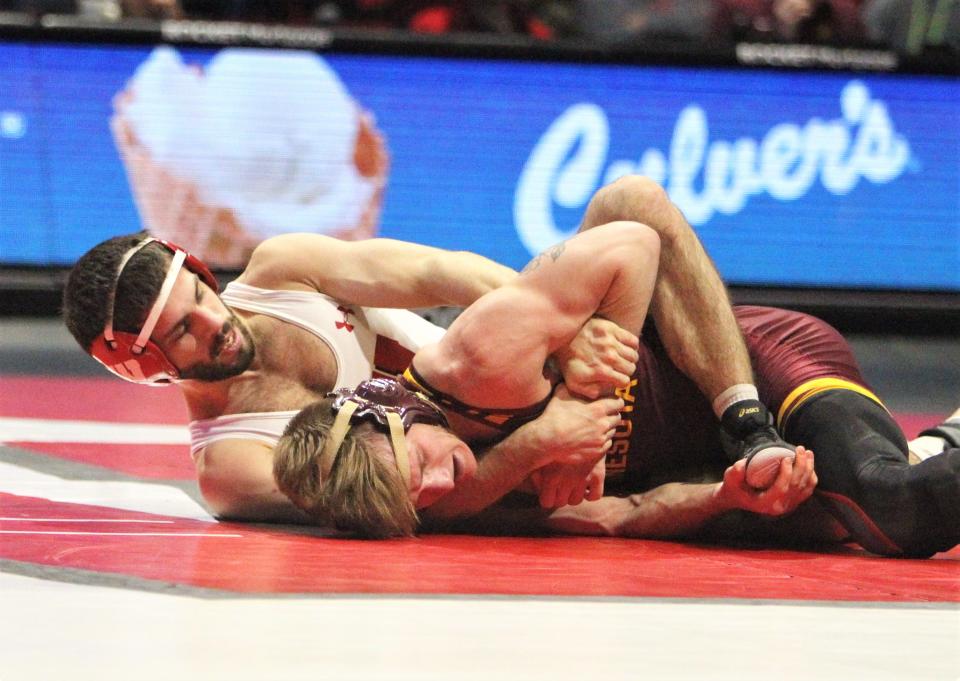 Wisconsin's Eric Barnett takes down Minnesota's Patrick Mckee during the 125-pound match of the teams' wrestling dual at the UW Field House in Madison, Wis. on Feb 11, 2023. Barnett won the match, 5-4, but Minnesota won the dual, 19-15.