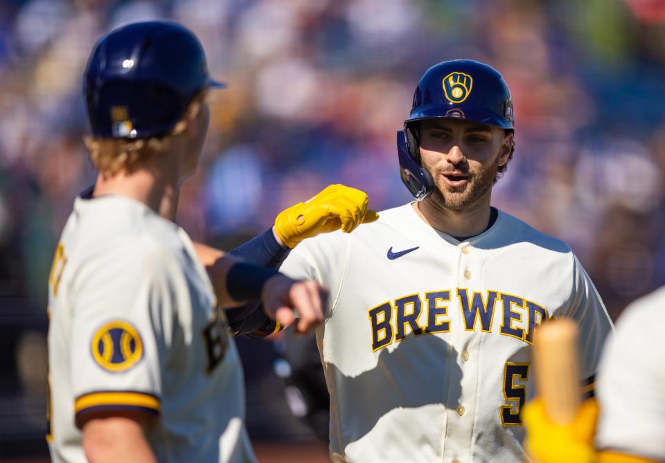 Milwaukee Brewers outfielder Garrett Mitchell (5) celebrates with teammates after hitting a home run against the Los Angeles Dodgers during a spring training game at American Family Fields of Phoenix, Feb 25, 2023, Phoenix, Arizona.