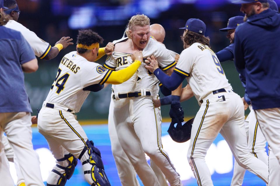 Brewers centerfielder Joey Wiemer celebrates with teammates after his walk-off single against the Orioles in the bottom of the 10th inning Tuesday night at American Family Field.
