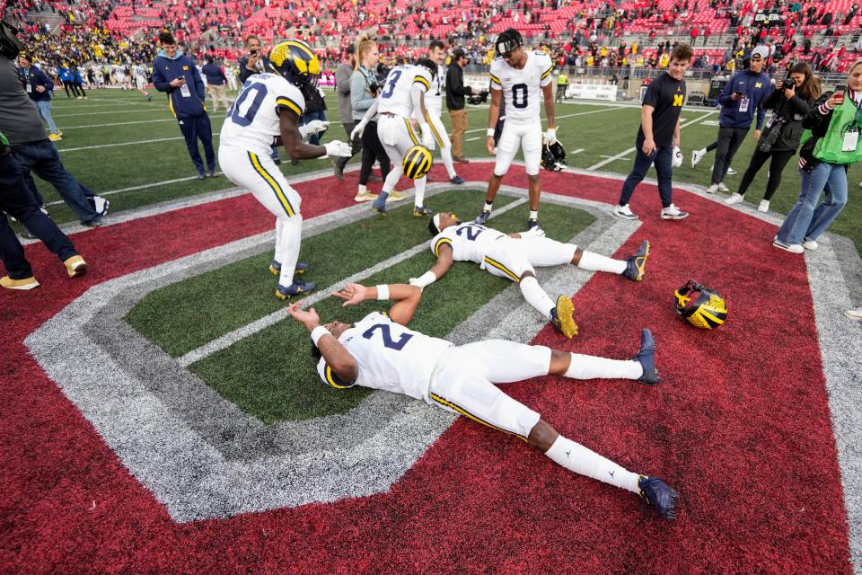 Michigan players celebrate following a 45-23 victory over Ohio State at Ohio Stadium on Nov 26, 2022, in Columbus, Ohio.
